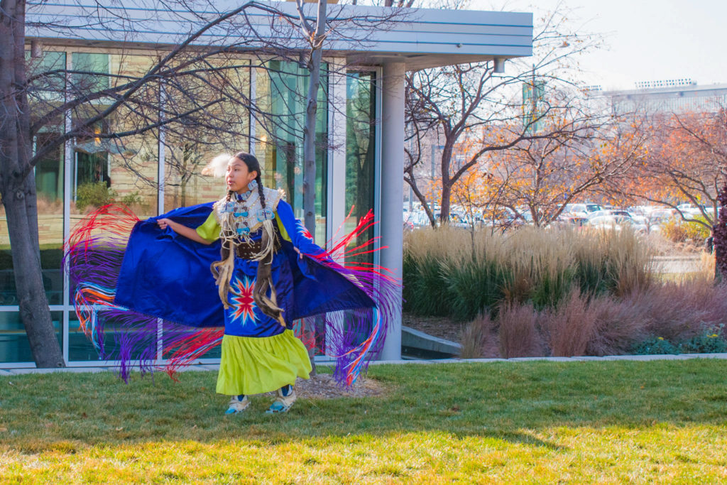 A young girl dances for her tribe’s Pow Wow at Colorado State University,